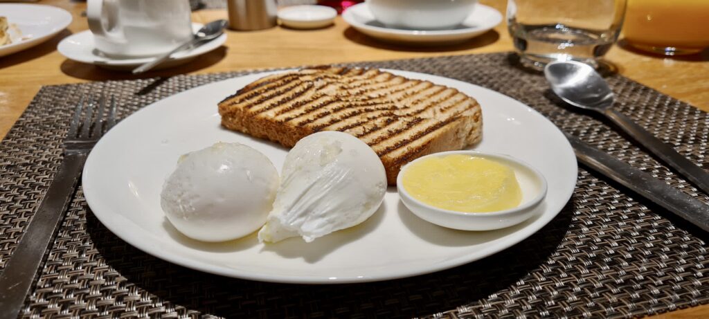 Eggs Only Breakfast - two poached eggs with multi grain bread, Qantas Lounge Tom Bradley Terminal Los Angeles