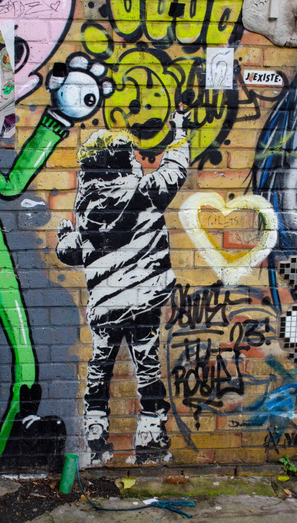 Kid with spray can by Dotmasters, Camden Town, London