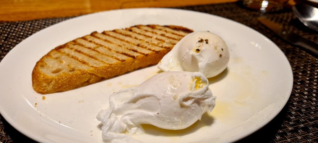 Poached Eggs and Toast at breakfast in Qantas First Lounge Los Angeles Airport