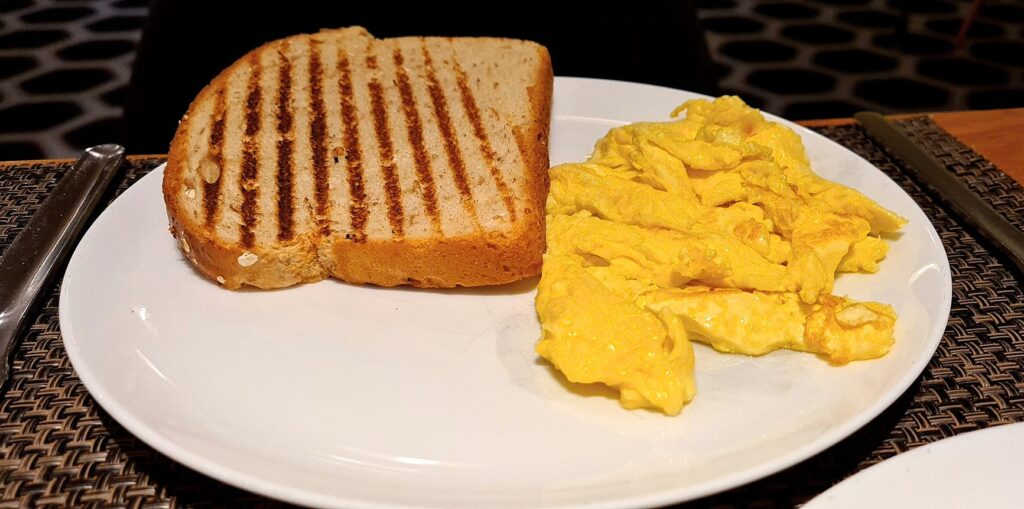 Scrambled Eggs and Toast at breakfast in Qantas First Lounge Los Angeles Airport