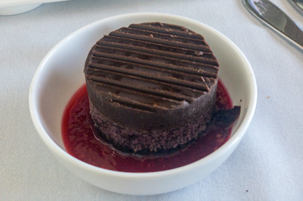 Cherry ripe cake with raspberry coulis on British Airways flight from Sydney to Singapore